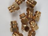 a bunch of brass fittings on a white surface
