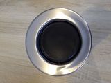 a cup of coffee sitting on a wooden table