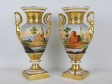 two vases that have been painted with a landscape on them