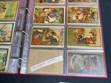 a red binder with a lot of cards inside of it