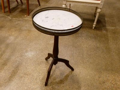 a small table with a marble top on a stand