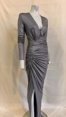 the dress is grey and has long sleeves and a v - neck