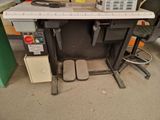 an image of a computer desk with a computer on it