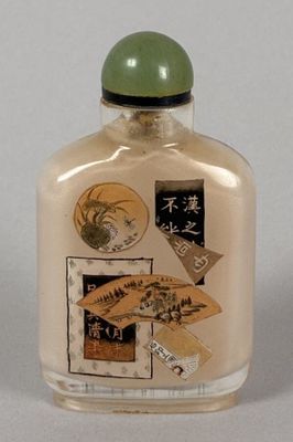 a glass bottle with a lot of stickers on it