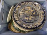 a blue and white plate in a blue box