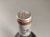 a bottle of wine that is sitting on a table