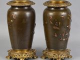 pair of antique bronze vases with flowers and birds on them
