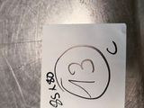 a sticker with a drawing of a smiley face on it