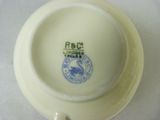 a white plate with a blue and white design on it