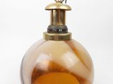 brown and white glass ornament on a white background