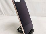 a cell phone that is on a stand on a table