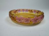 an image of a yellow and pink bowl with flowers on it