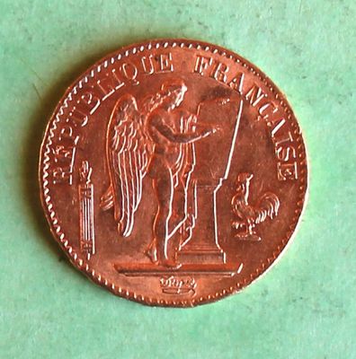 an image of a penny that is sitting on a green surface