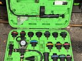 an image of a green case filled with tools on top of a table