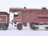 a toy train that is sitting on a white surface