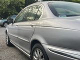 a silver car parked on the side of the road