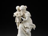 an image of a statue of a woman holding a child