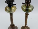 pair of antique brass and green glass oil lamps on pedestals
