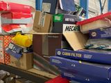 a pile of boxes and boxes on a shelf in a warehouse