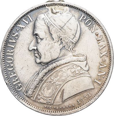 an old silver coin with a portrait of a man on it