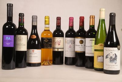 many bottles of wine that are lined up on the table