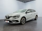 a white car in a white room with a black floor