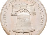 an image of a commemorative coin with a liberty bell on it