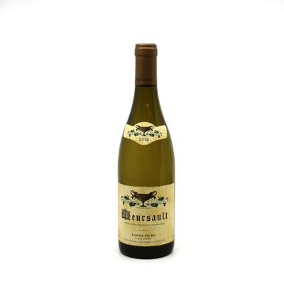 a bottle of wine that is sitting on a table