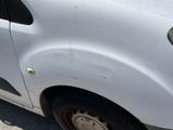 a white van that is parked on the side of the road