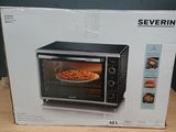 packaging for a microwave oven sitting on a table with a pizza in it