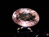 an image of a pink diamond on a black surface