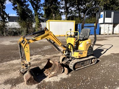 a small excavator that is sitting in the dirt