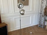 a lamp that is on a stand in a room