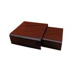two brown wooden boxes sitting on top of each other on a white surface