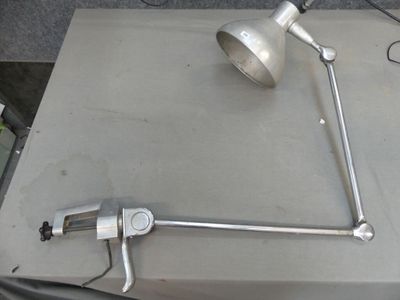 a picture of a table with a lamp and some tools on it