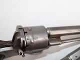 a close up of a gun that is on a table