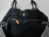 a black bag with a zipper on it sitting on a table