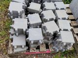 a pile of concrete blocks sitting on a pallet