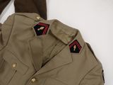 an image of a military uniform jacket with a red, white, and blue stripe on the collar