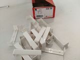several pieces of white plastic are sitting on a white surface