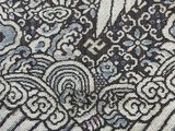 a close up of a piece of fabric with a design on it