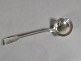 a silver spoon with a spoon handle on a table