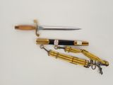 three different types of knives on a white surface