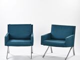 pair of mid century modern lounge chairs in teal velvet upholstered with chrome legs