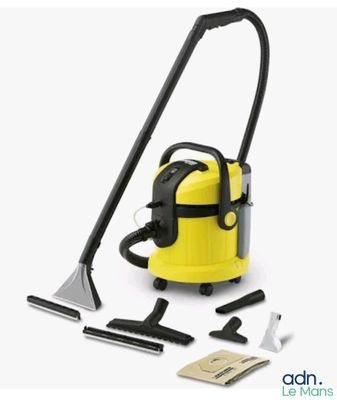 a yellow and black vacuum cleaner with tools on a white background