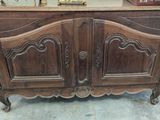 a wooden cabinet that has a clock on top of it
