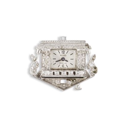 une photo d'une montre en or blanc sertie de diamants