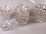 a lot of glass cups and glasses on the table