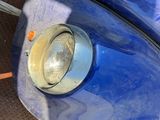 an image of a blue scooter parked on the side of the road