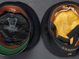 two hats that are sitting side by side on a table